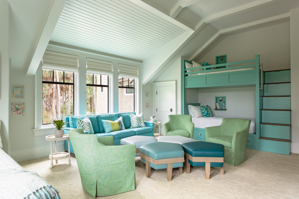 Custom bunk room with bright teal and green colors utilized throughout